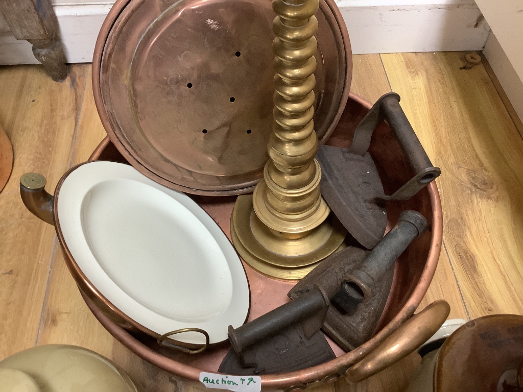 A group of mixed copper, brass and stoneware